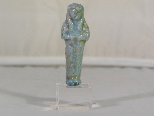 EGYPTIAN STYLE FAIECE USHABTI: Egyptian style faience ushabti,plexiglas pedestal. Size: h.7 cm.(2.76")