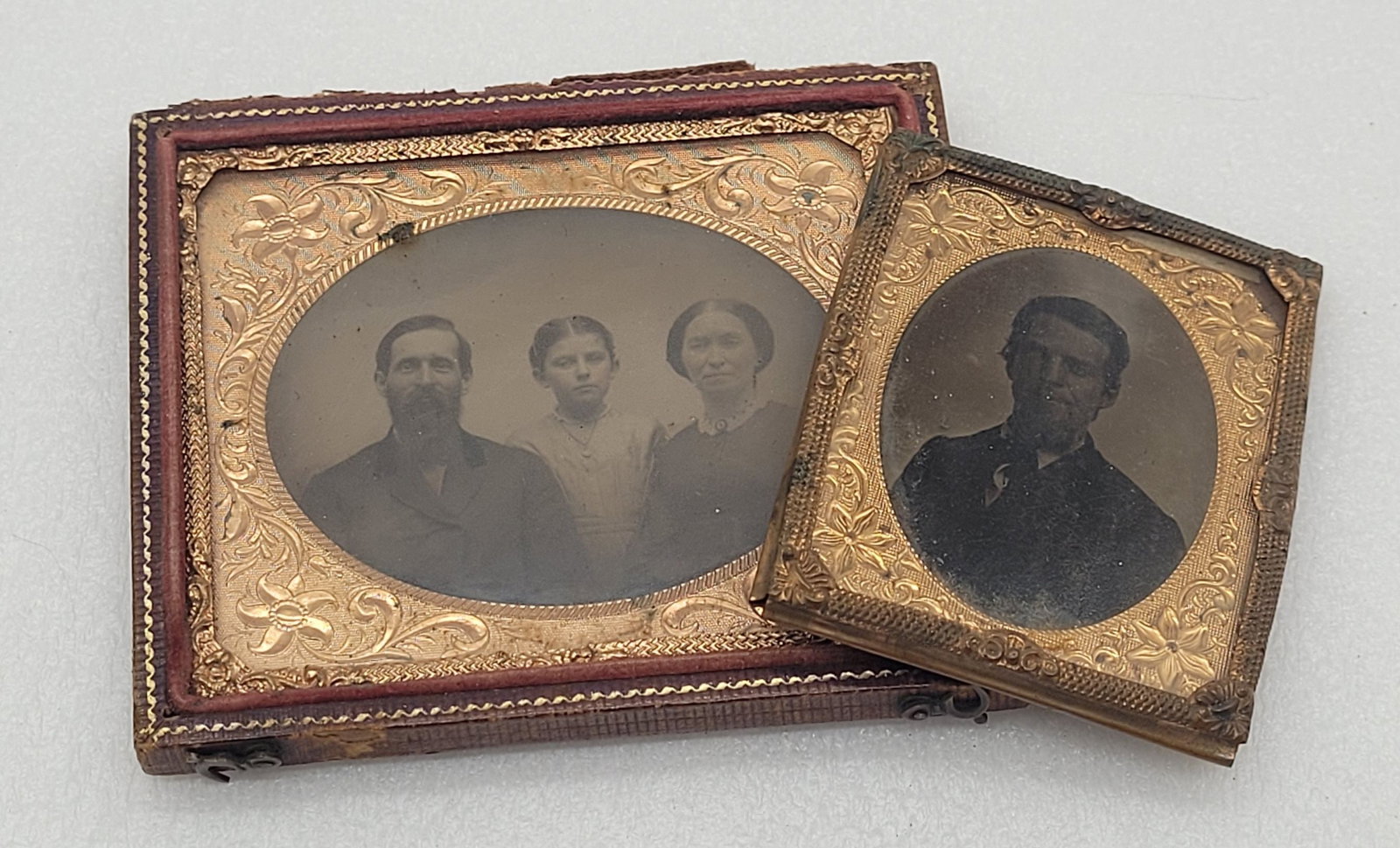 Tintypes (2) Half Cased Family & Uncased Portrait of Man: Tintypes (2) Half Cased Family & Uncased Portrait of Man - 2.5" by 2" uncased, 3" by 3.5" half cased.