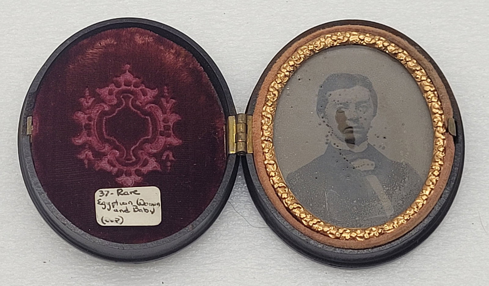Tintype in Oval Case of Woman Case depicts Mother & Father w Baby & Dog: Tintype in Oval Case of Woman Case depicts Mother & Father w Baby & Dog - 2.5" by 2".