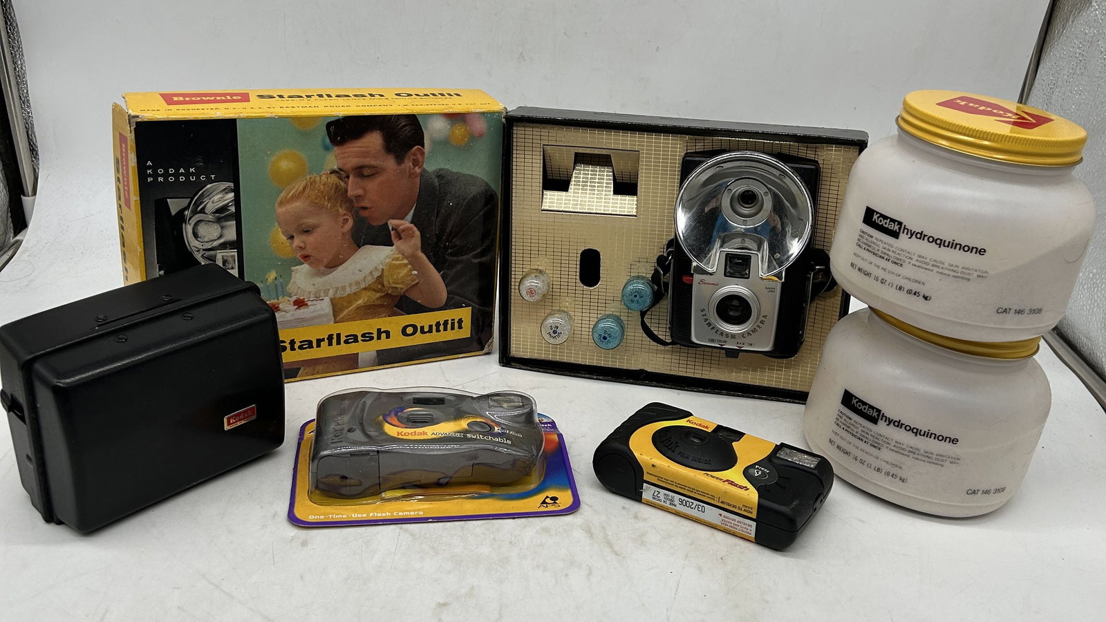 Kodak Brownie Starflash Outfit Disposable Cameras Hydroquinone Bottles: Kodak Brownie Starflash Outfit, Disposable Cameras, Hydroquinone Bottles - Sizes vary.