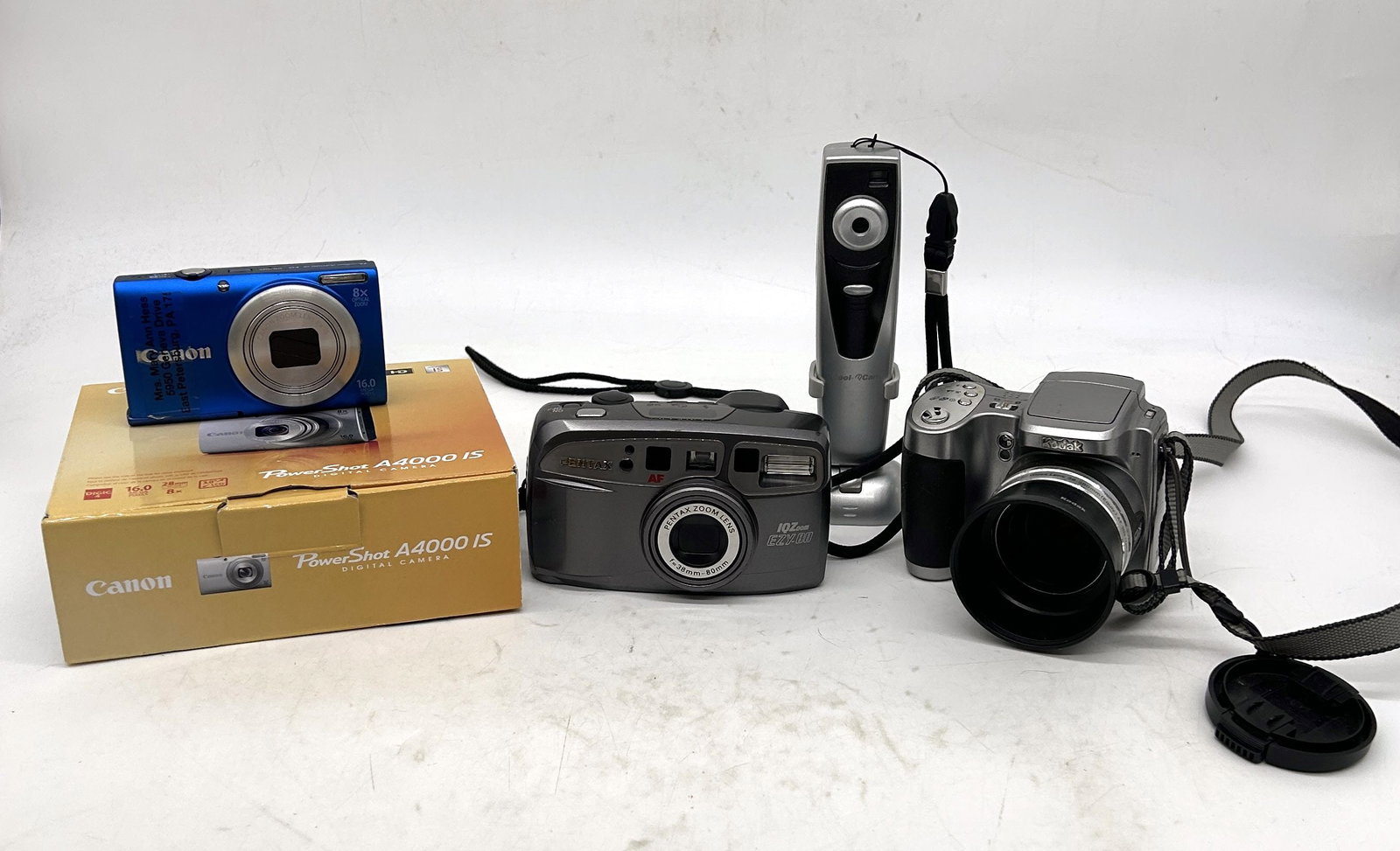 Kodak EasyShare Z740 Cannon Powershot A4000 Pentax Camera iCool Cam: Kodak EasyShare Z740, Cannon Powershot A4000, Pentax Camera, iCool Cam - Sizes vary.