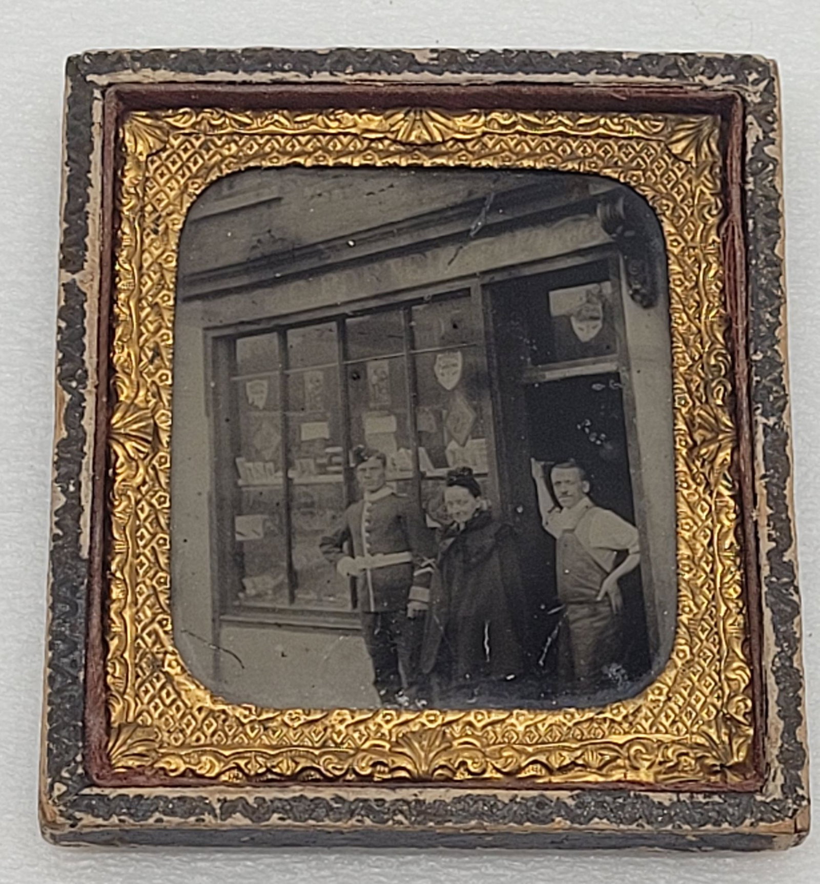 Ambrotype of Storefront Man In Uniform Woman & Shop Owner Half Cased Omage: Ambrotype of Storefront Man In Uniform Woman & Shop Owner Half Cased Omage - 3.5" by 3.25".