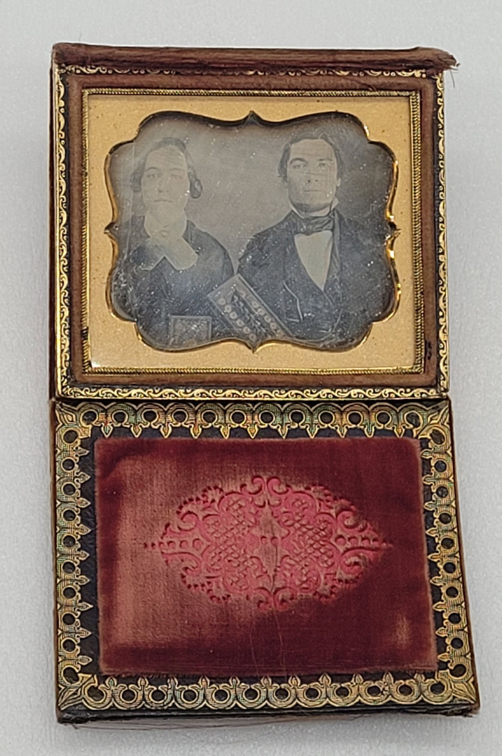 Daguerreotype of Couple Woman w Bible Man: Daguerreotype of Couple Woman w Bible Man - 3.5" by 3.75".