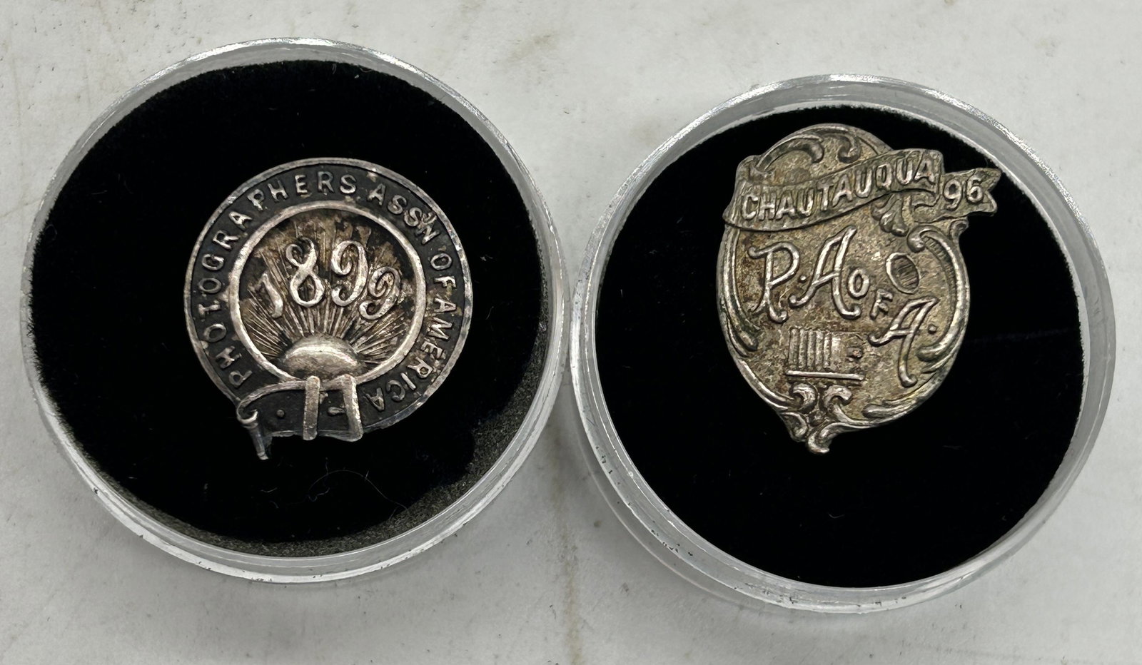 Photographers Association of America 1899 Lapel Pin Chautauqua 1896 PA of A Lapel Pin: Photographers Association of America 1899 Lapel Pin, Chautauqua 1896 PA of A Lapel Pin - Sizes vary. Mostly 1"
