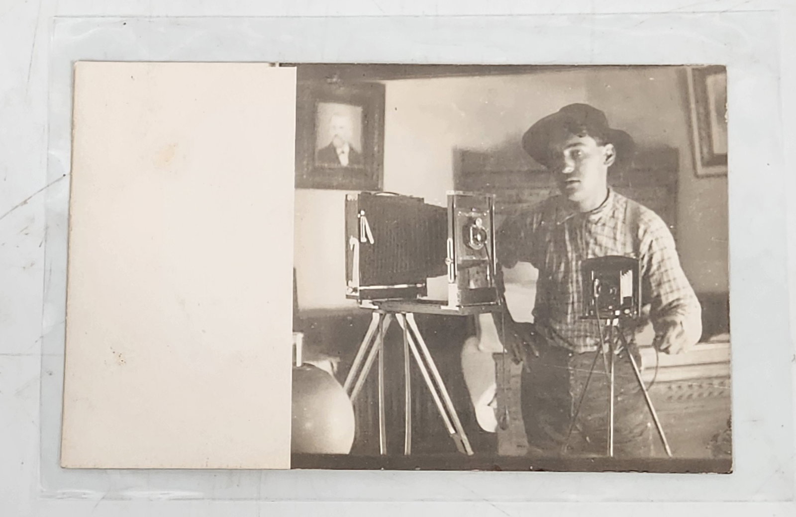 RPPC Photo Postcard: Man with Antique Cameras on Tripods Mirror Selfie: This is a vintage postcard featuring a black and white image of a man with two antique cameras. The postcard is addressed to Miss Katie Costa in Challenge, California (Yuba County). The image shows th