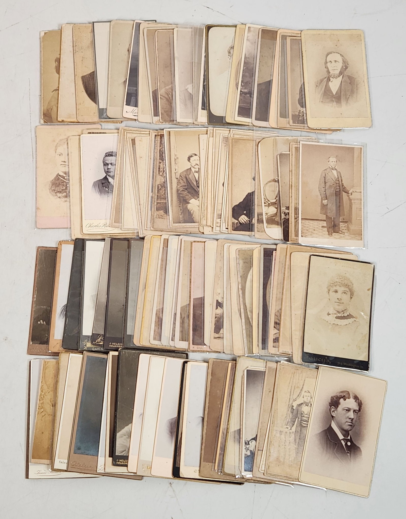 Antique Cdv Photo Lot - Late 1800s/Early 1900s: This is a large collection of antique cabinet cards from a variety of photographers. Each card measures approximately 4 x 2.5 inches and features portraits of people from the late 1800s and early 1900