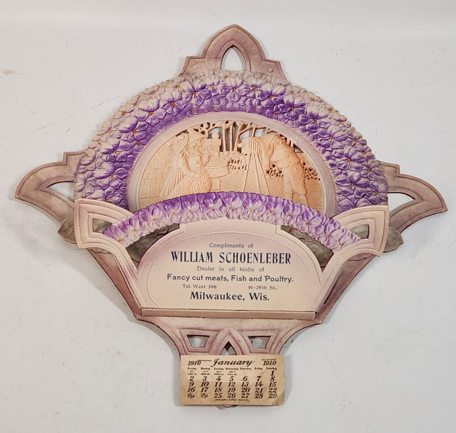 Vintage 1910 William Schoenleber Calendar - Milwaukee Advertising: This is a vintage 1910 calendar advertising William Schoenleber, a dealer in fancy cut meats, fish, and poultry in Milwaukee, Wisconsin. The calendar is made of cardboard and features a decorative des