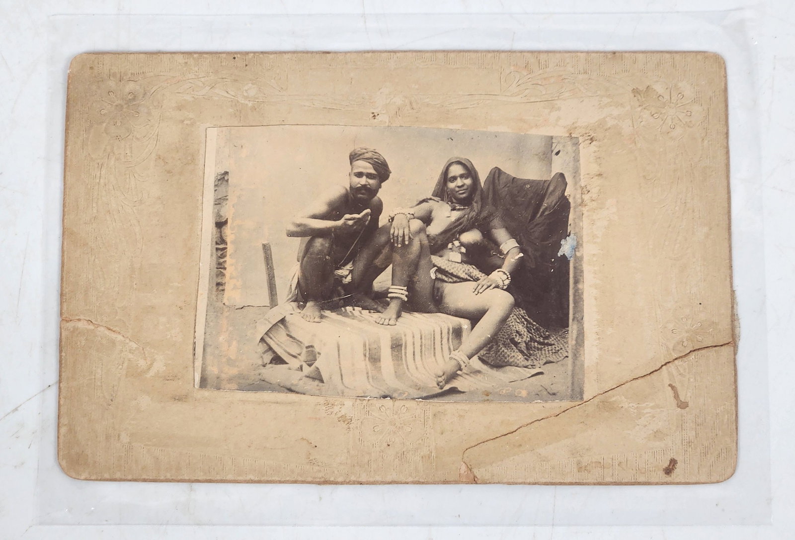 Board Mounted Pimp & Prostitute Photograph: Vintage photograph showing what appears to be a pimp and prostitute. The cardboard frame of the photograph measures approximately 5.75" x 3.75".height: 5.75 inches (cardboard frame); width: 3.75 inche