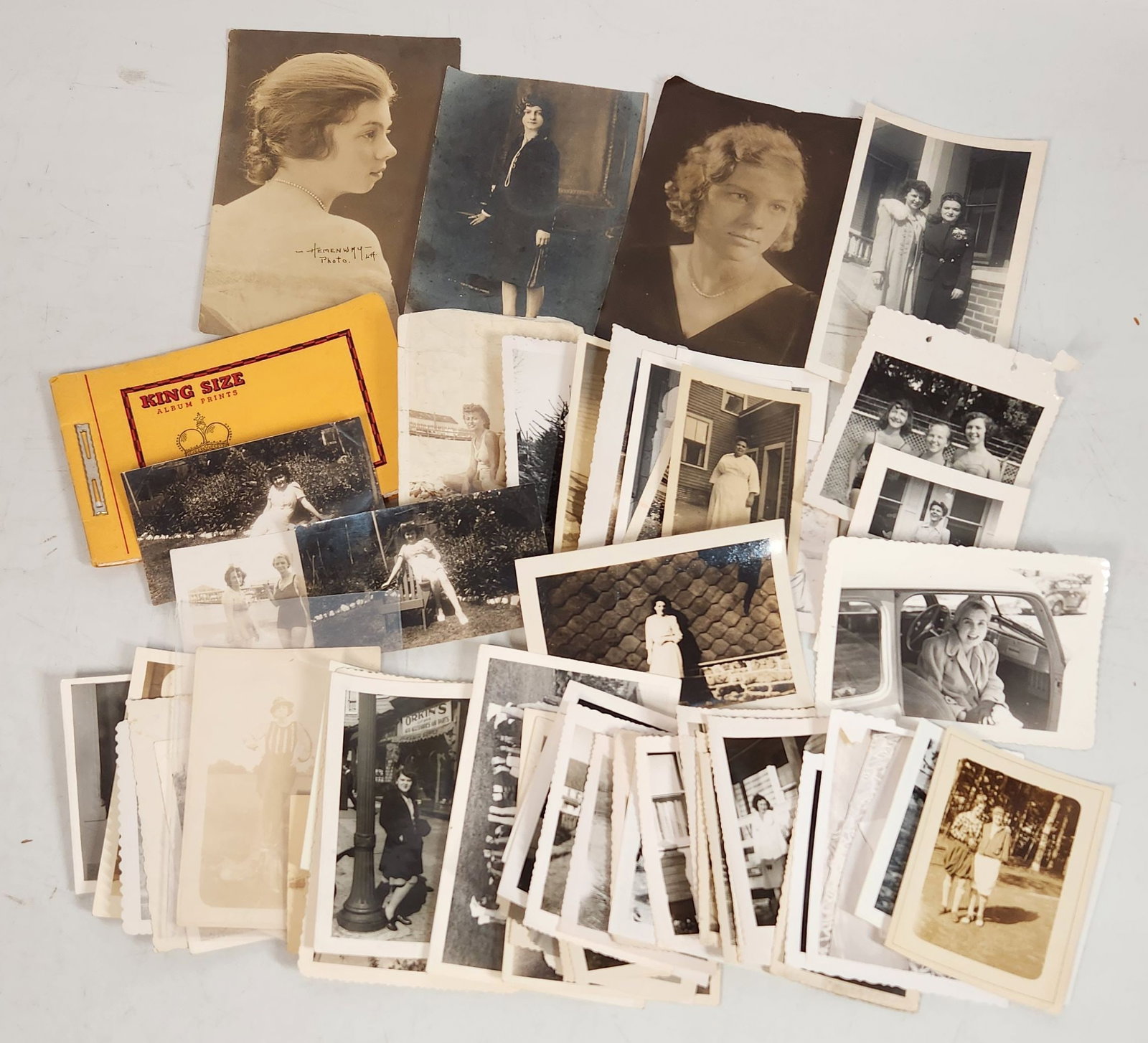Vintage Black & White Photographs - King Size Album: This is a collection of vintage black and white photographs. The photos depict a variety of scenes, including portraits of young women, group photos, and snapshots of people in various settings. Some 
