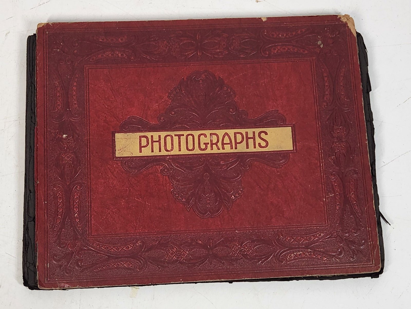Vintage Photograph Album - Red Cover, Niagara Falls Photos, 13.5": This is a vintage photograph album with a red cover that has decorative detailing. The front of the album reads "Photographs" in gold lettering. Inside the album, the photographs are adhered to black 