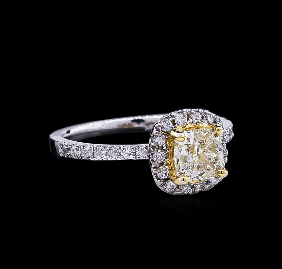 1.34 ctw Fancy Light Yellow Diamond Ring - 14KT: One electronically tested 14KT white and yellow gold lady's combination cast & assembled wedding ring with a halo with a bright polish finish. The featured lady's ring has a shank measuring 1.70 milli