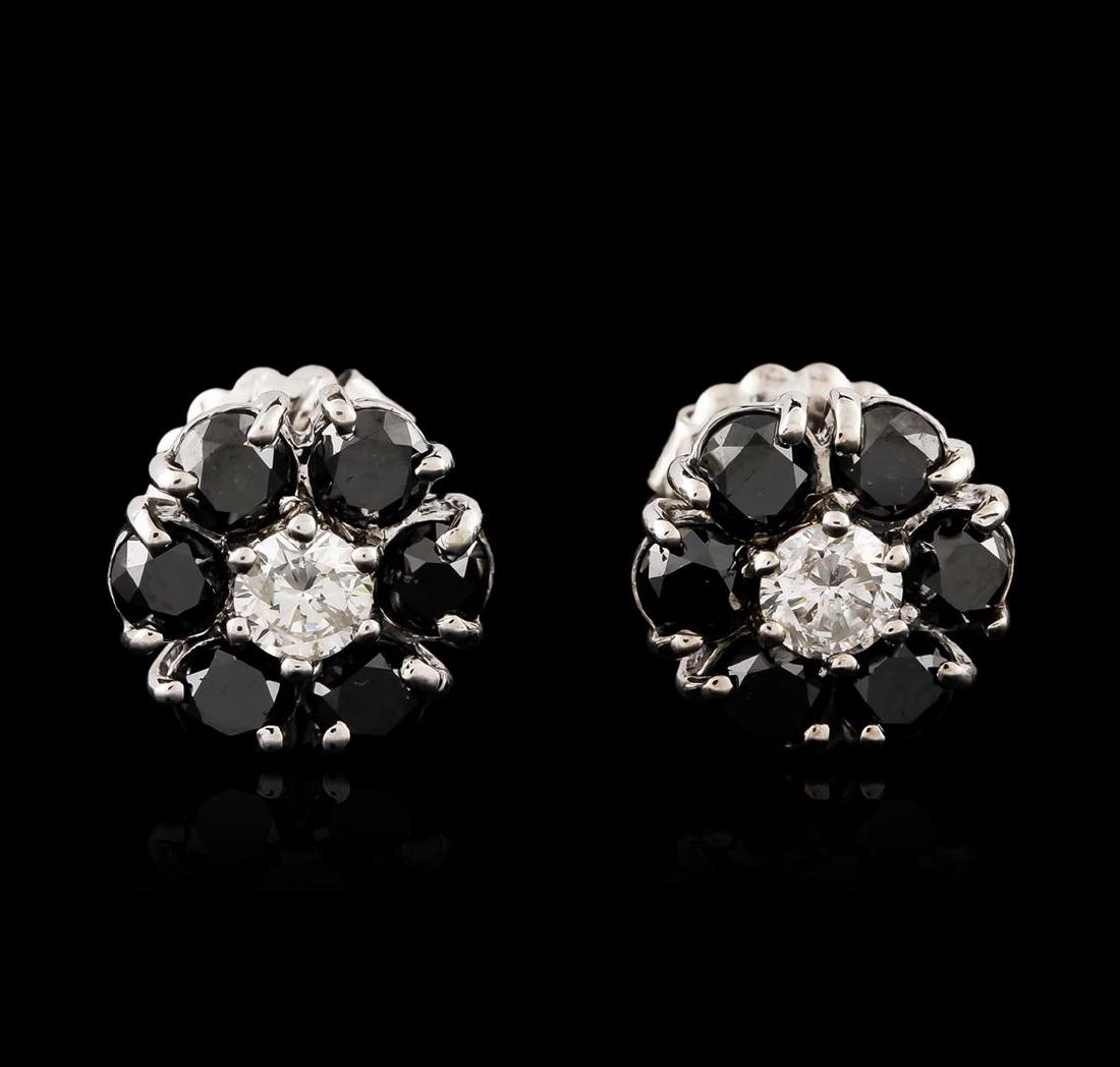 14KT White Gold 3.32 ctw Black and White Diamond: One pair electronically tested 14KT white gold ladies cast & assembled black and white diamond floret earrings with standard backs. Bright polish finish. Condition is good. Containing: Twelve prong se