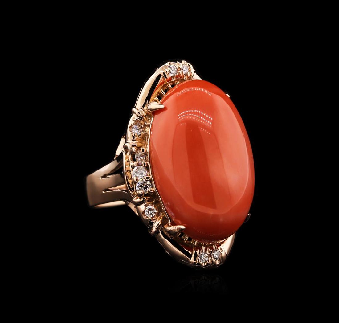 14KT Rose Gold 16.11 ctw Pink Coral and Diamond Ring: One electronically tested 14KT rose gold ladies cast coral and diamond ring with a bright polish finish. Identified with markings of "14K". Condition is new. Containing: One prong set oval cabochon cu