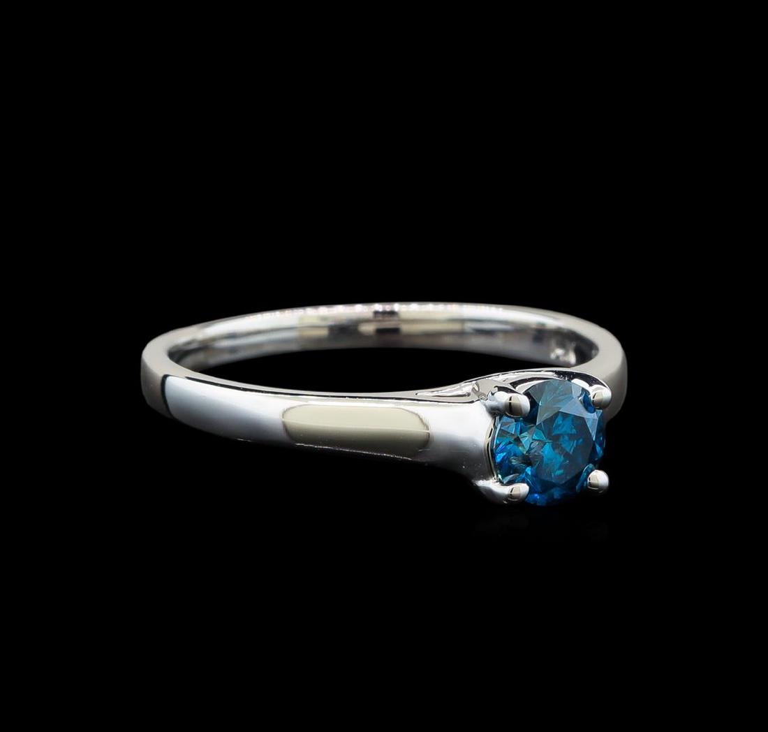 14KT White Gold 0.47 ctw Round Cut Fancy Blue Diamond: One electronically tested 14KT white gold ladies cast diamond solitaire ring with a cathedral shank with a bright polish finish. Identified with markings of "14K". Condition is new. Containing: One pr
