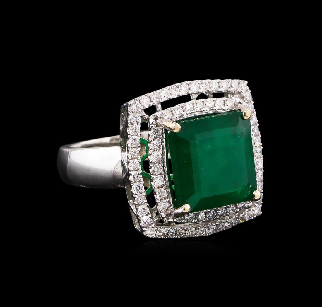 14KT White Gold 6.03 ctw Emerald and Diamond Ring: One electronically tested 14KT white gold Ladies combination cast & assembled ring with a bright polish finish. Condition is new. Containing: One prong set emerald standard step cut natural emerald, m