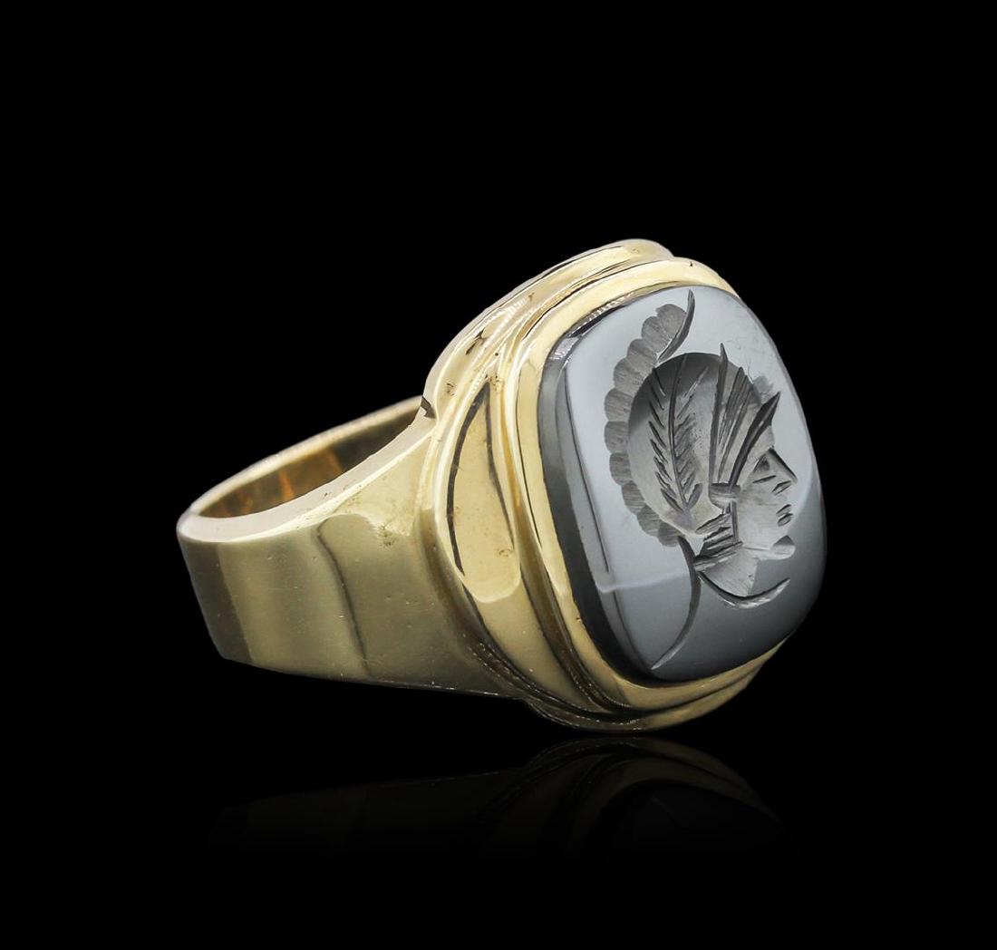 10KT Yellow Gold 5.90 ctw Hematite Ring: One electronically tested 10KT yellow gold mens cast hematite ring with a bright polish finish. Identified with markings of "10K". Condition is very good. Containing: One bezel set intaglio cut natura