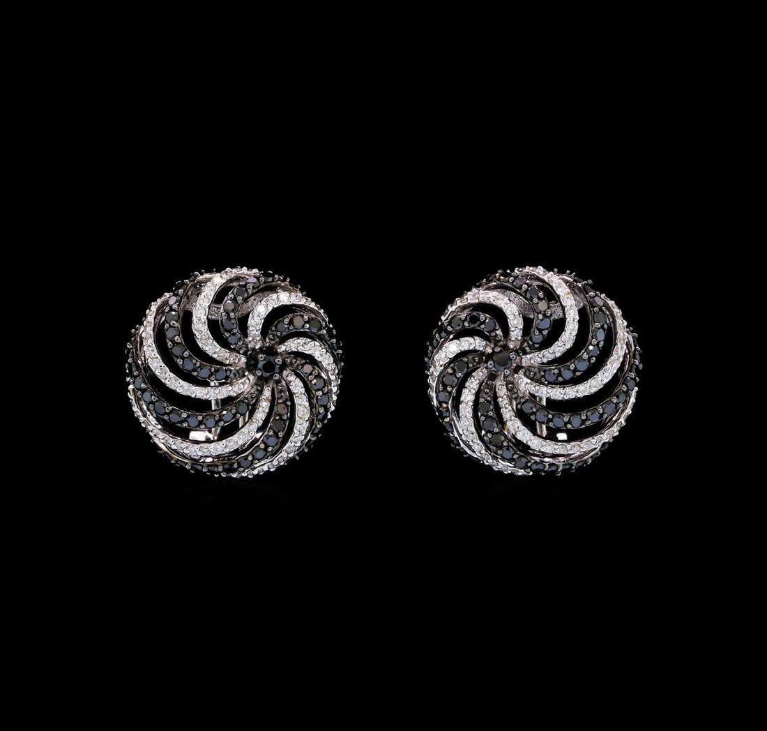 1.79 ctw Black and White Diamond Earrings - 18KT White: One pair of earrings featuring: 18KT white gold weighing 5.9 grams containing black diamonds weighing 1.27ctw and diamonds weighing 0.52ctw.