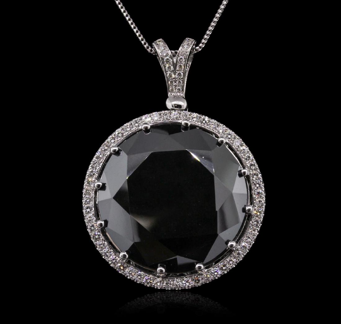 14KT White Gold 101.06 ctw Black and White Diamond: One electronically tested 14KT white gold ladies cast & assembled black and white diamond pendant. Condition is new, good workmanship. The pendant features a black diamond set within a white diamond b