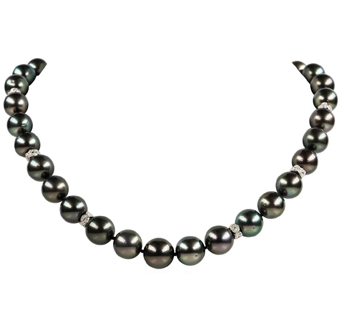 Pearl and Diamond Necklace: One graduated single strand pearl necklace 19.5' princess length, knotted with a tongue clasp & foldover safety containing 33 Tahitian pearls, 14.9mm to 12.0mm in size. The pearls are black in color, 