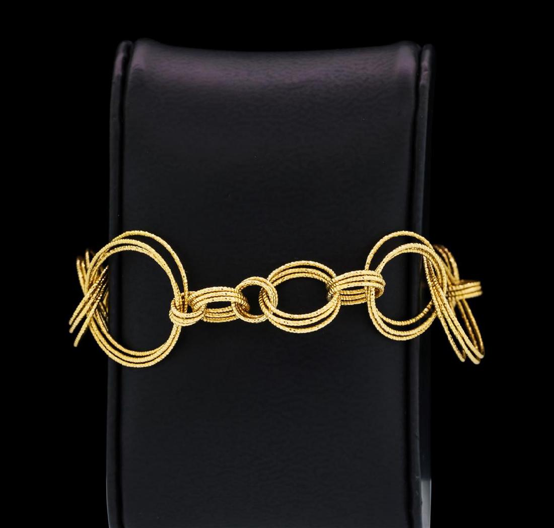 Robert Coin Bracelet - 18KT Yellow Gold: One electronically tested 18KT yellow gold lady's combination cast & assembled fashion circle bracelet with a toggle clasp with a bright polish finish. The feature lady's bracelet is a Roberto Coin br