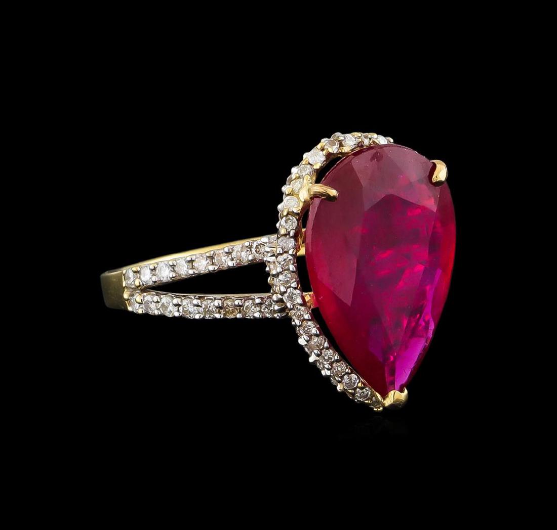 14KT Yellow Gold 5.42 ctw Ruby and Diamond Ring: One electronically tested 14KT yellow gold ladies cast ruby and diamond ring with a bright polish finish. Identified with markings of "14K". Condition is new. Containing: One prong set pear modified b