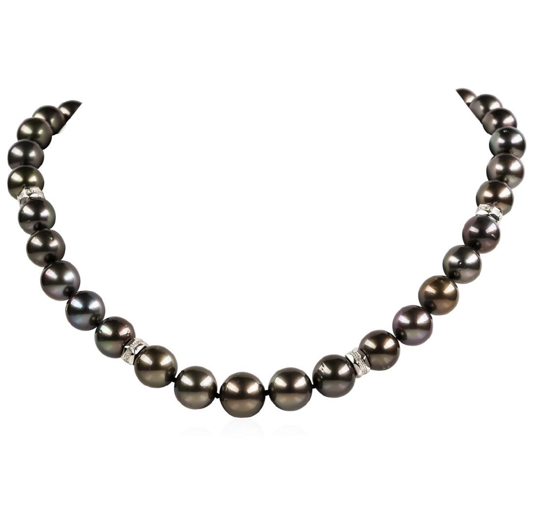 Pearl and Diamond Necklace: One graduated single strand pearl necklace 19.0' princess length, knotted with a tongue clasp & foldover safety containing 35 Tahitian pearls, 13.6mm to 11.0mm in size. The pearls are black in color, 