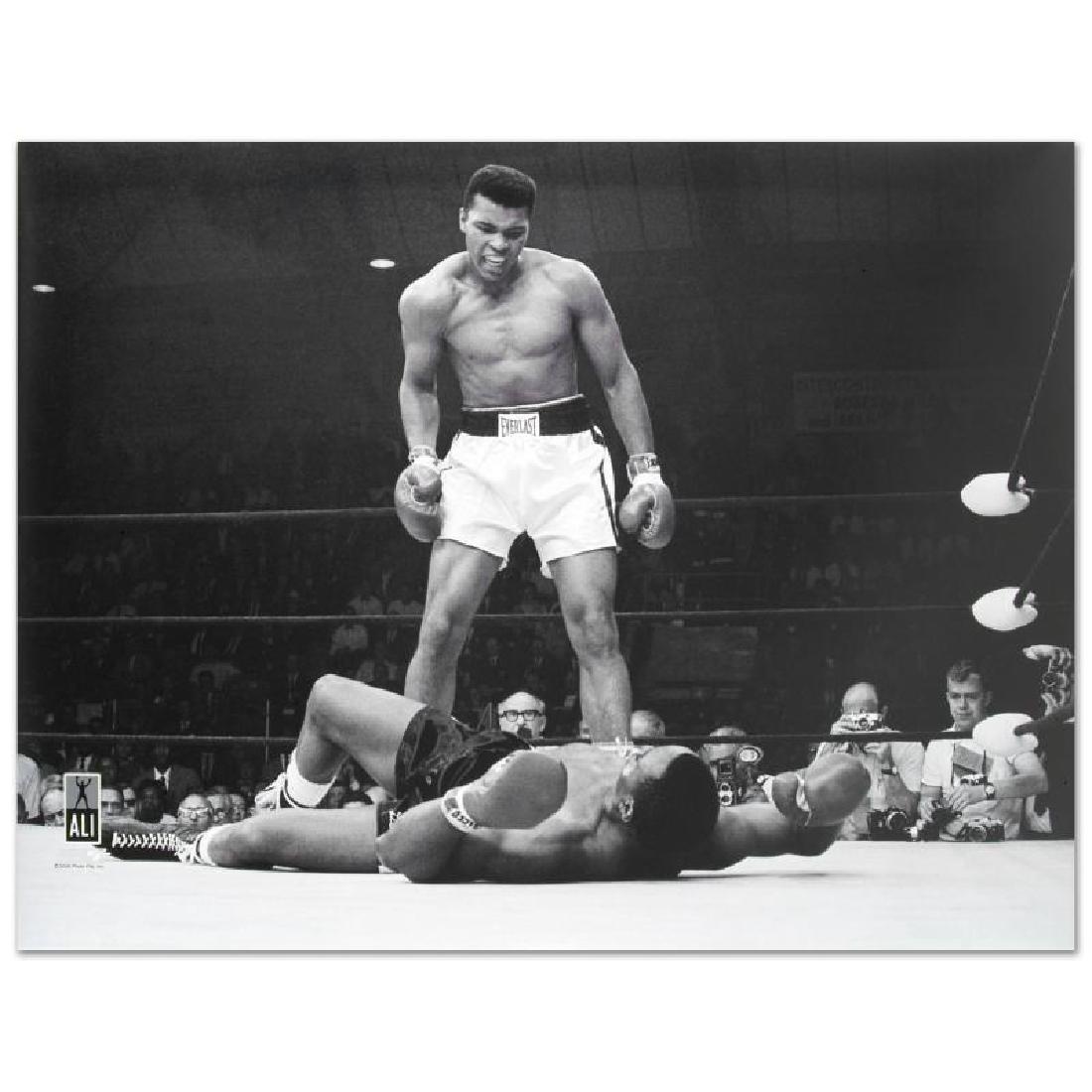 Muhammad Ali Photo: This photo, commemorating Ali and Sonny Liston's anticipated fight, is part of sports history. Taken during the first-round knockout of his championship fight against Liston, this photo is sure to com