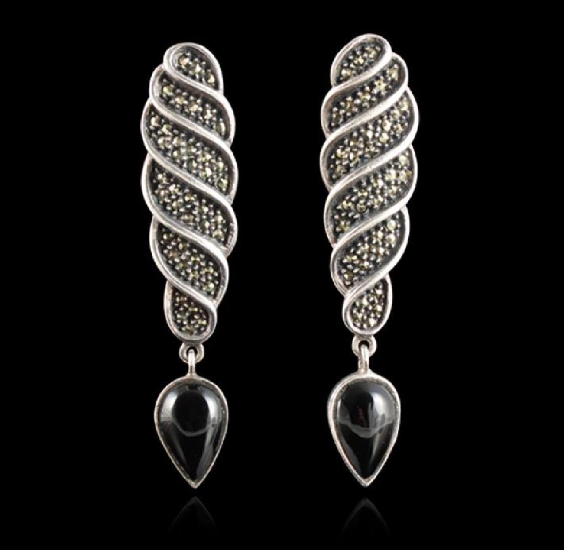 Judith Jack Sterling Silver Onyx & Marcasite Earrings: One pair of genuine Judith Jack sterling silver onyx and marcasite dangle teardrop earrings featuring: 14.6 grams of sterling silver. Drop-1 1/2in, Width 5/8 at widest point. Stamped with 925 and Judi