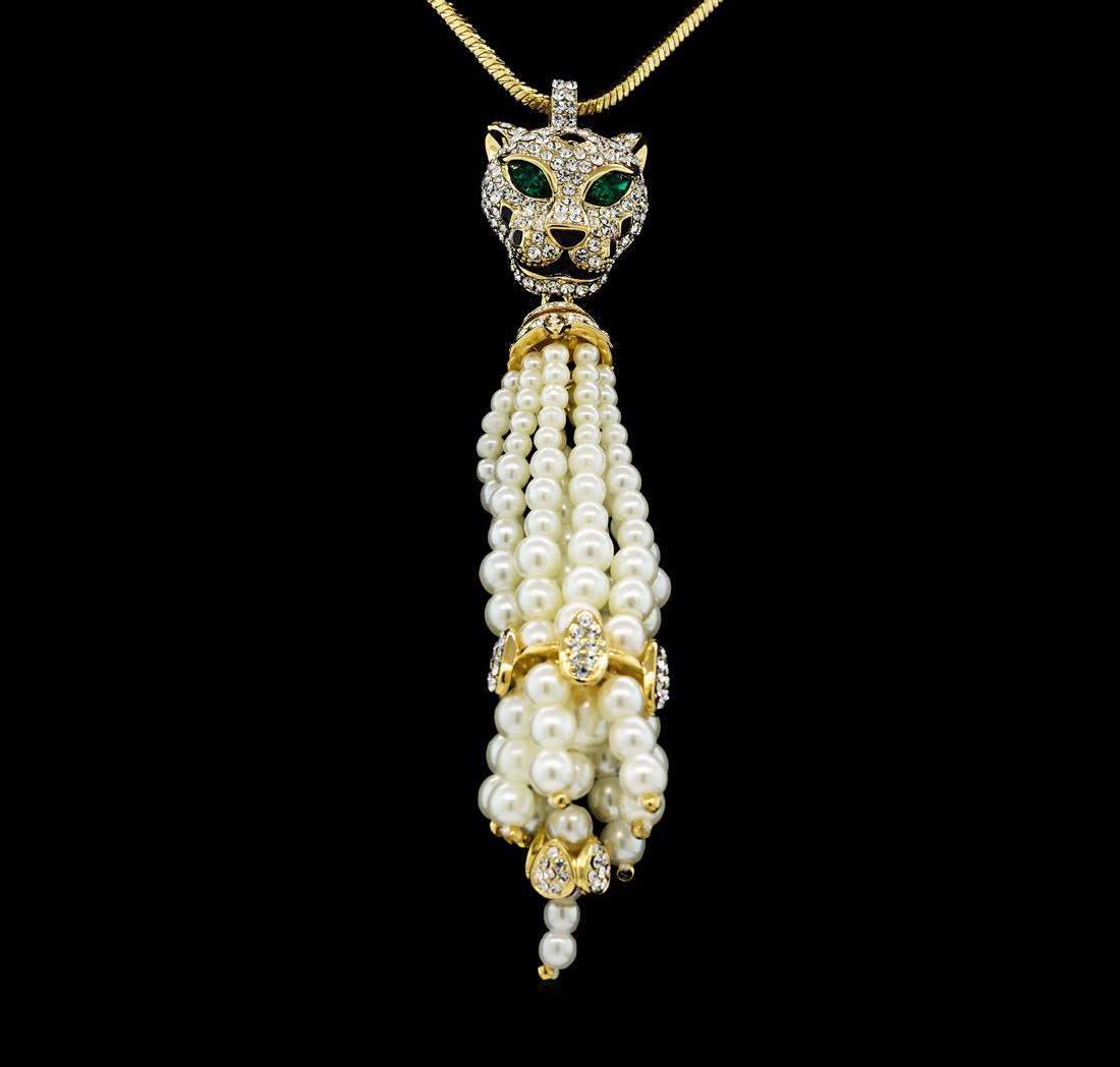 Panther Pearl Tassel Necklace - Gold Plated: High end designer jewelry. Panther Pearl Tassel Necklace - Gold Plated. Gold Plated Chain/1.5" Ext Clasp. Gold/ White. 20/3inches.