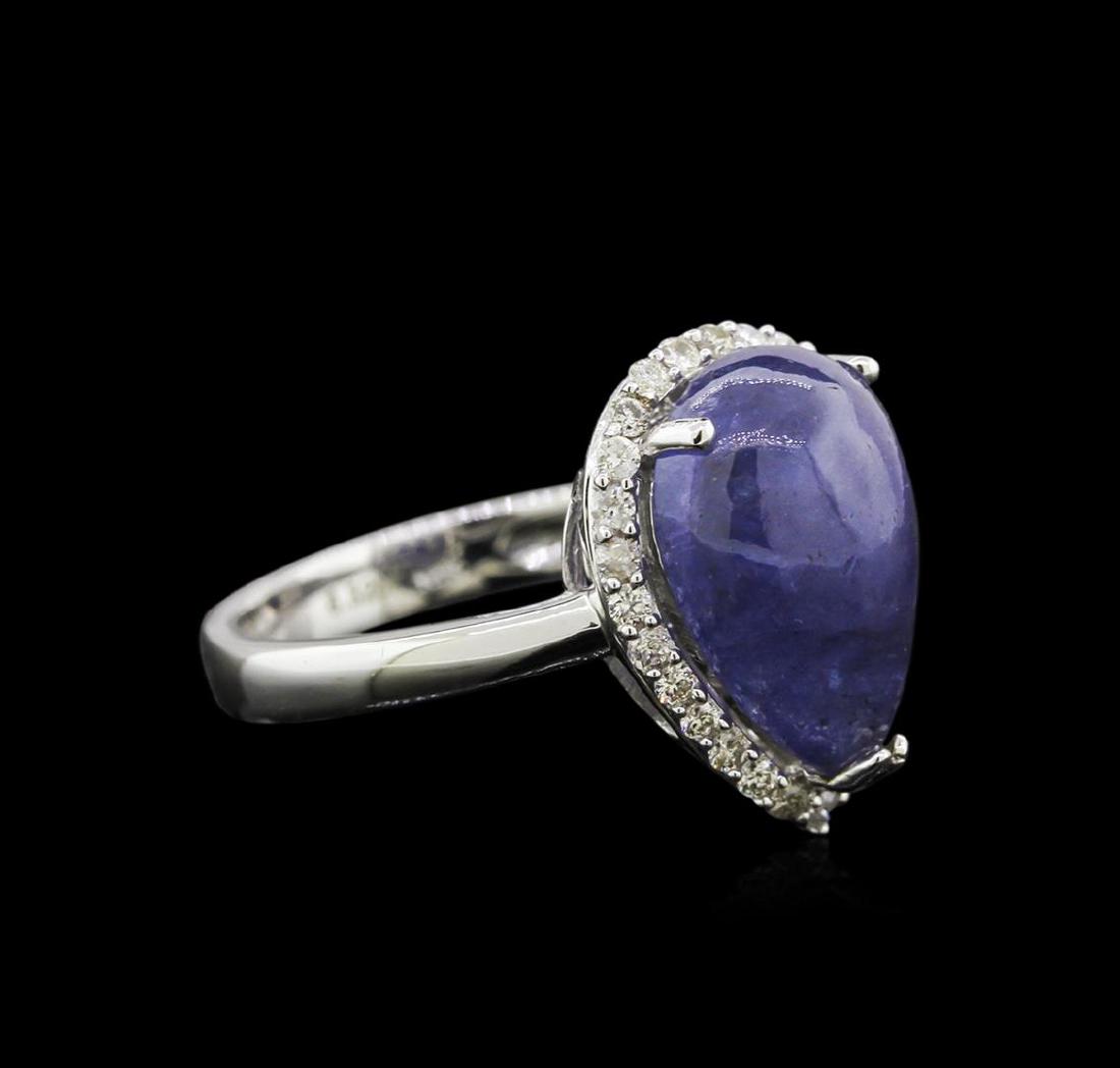 6.32 ctw Tanzanite and Diamond Ring - 14KT White Gold: One electronically tested white gold ladies cast tanzanite and diamond ring with a bright polish finish. Condition is new, good workmanship. The featured tanzanite is set within a diamond bezel suppor