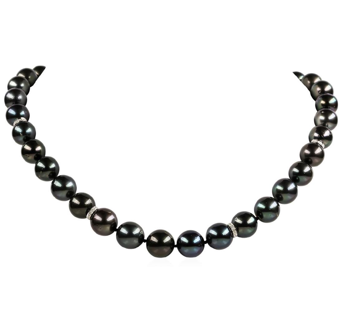 Pearl and Diamond Necklace: One graduated single strand pearl necklace 19.0' princess length, knotted with a tongue clasp & foldover safety containing 35 Tahitian pearls, 13.2mm to 11.1mm in size. The pearls are black in color, 