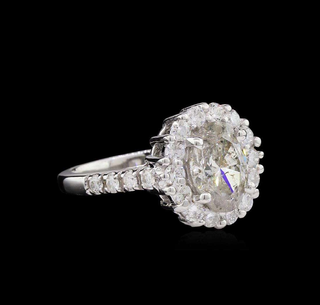 2.77 ctw Diamond Ring - 14KT White Gold: One electronically tested 14KT white gold lady's cast wedding ring with a basket halo with a bright polish finish. The featured lady's ring has a shank measuring 2.01 millimeters wide. Identified with