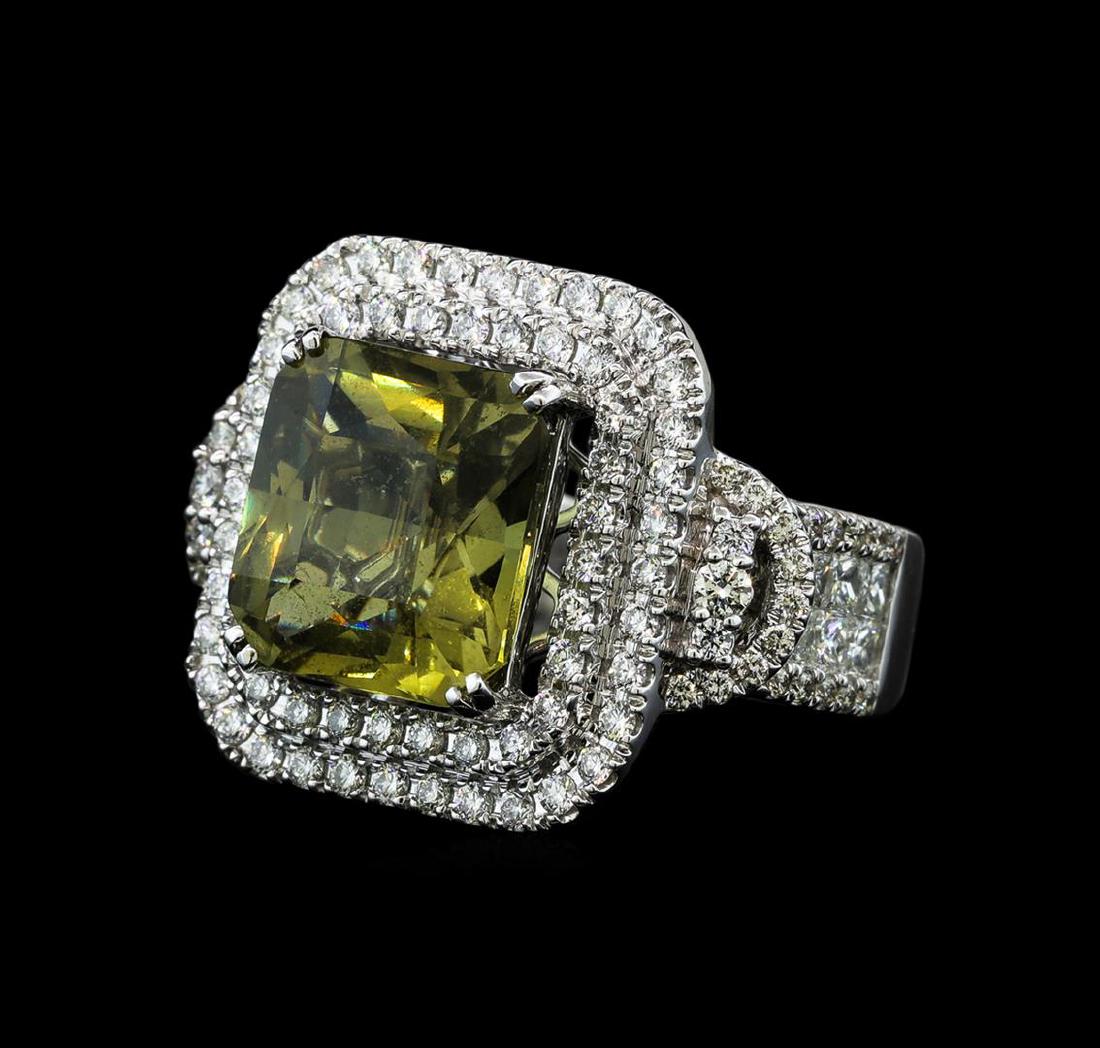 9.71 ctw Yellow Sapphire and Diamond Ring - 14KT White: One electronically tested 14KT white gold lady's cast fashion ring with a double cushion halo with a bright polish finish. The featured lady's ring has a shank measuring 3.55 millimeters wide. Identif