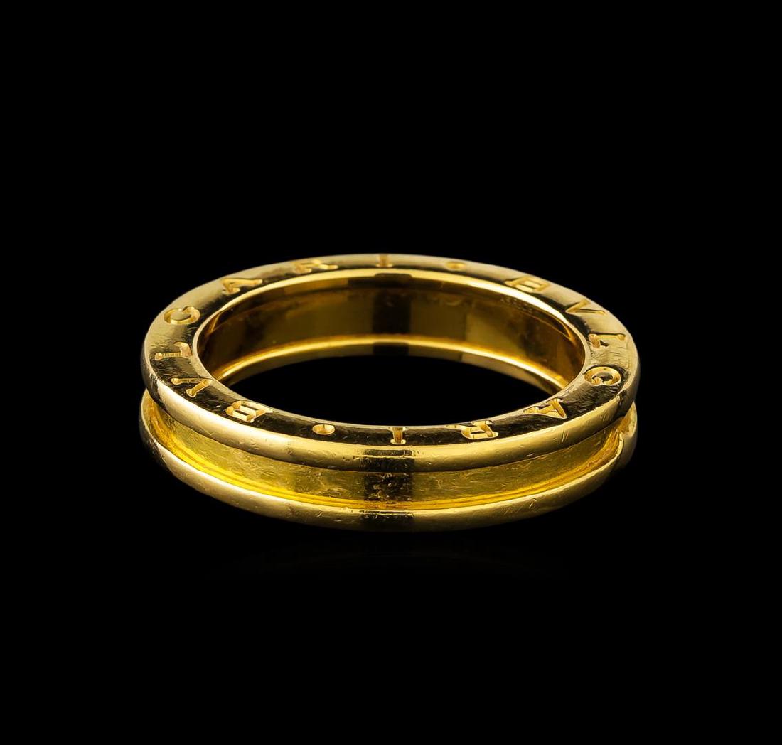 Bvlgari 18KT Yellow Gold Ring: One electronically tested 18KT yellow gold custom cast ring with a bright polish finish. The ring is part of Bvlgari's B. Zero1 Collection. The continuous four and one-half millimeter wide ring featur