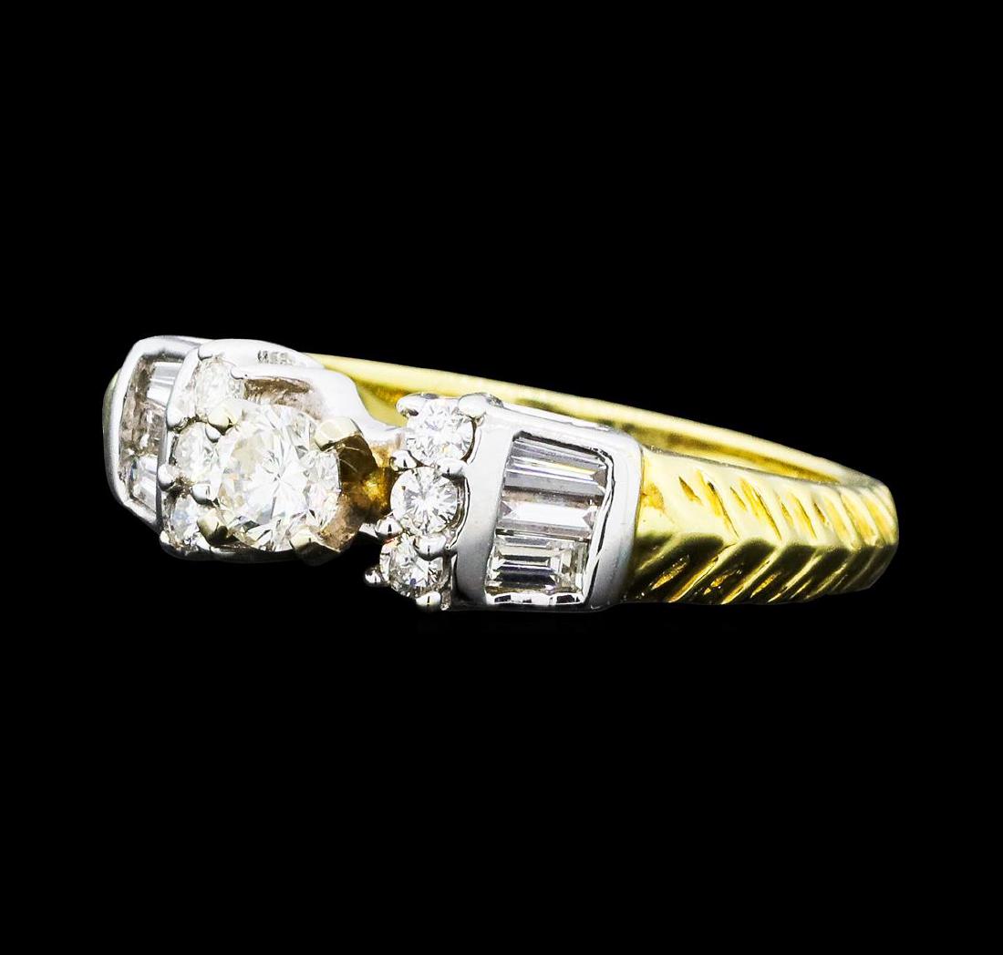 0.64 ctw Diamond Ring - 14KT Yellow And White Gold: One electronically tested 14KT yellow and white gold lady's combination cast & assembled wedding ring with a tapered cathedral shank with a bright polished textured finish. The featured lady's ring ha