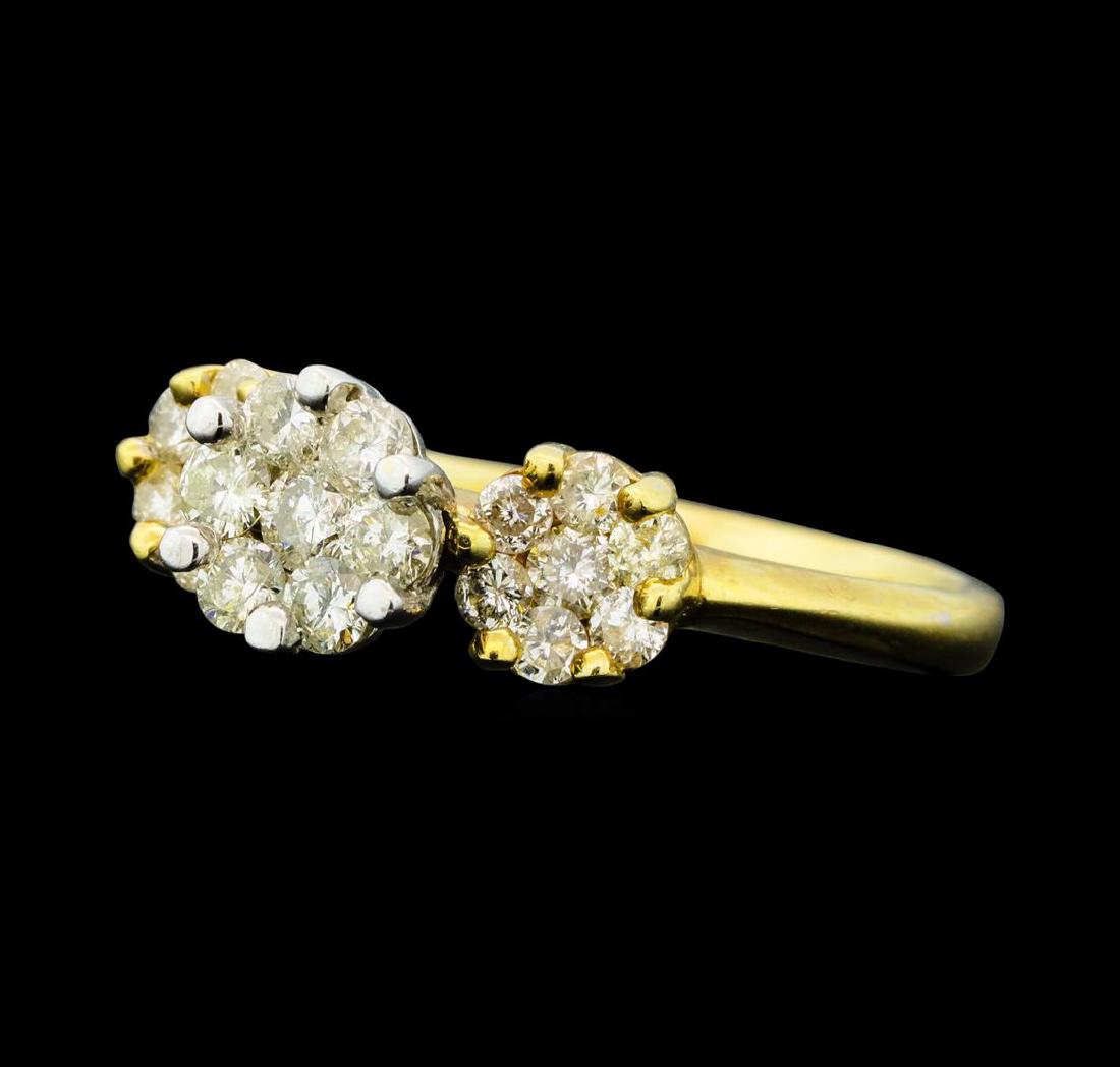 0.90 ctw Diamond Ring - 14KT Yellow And White Gold: One electronically tested 14KT yellow and white gold lady's cast wedding ring with a bright polish finish. The featured lady's ring has a shank measuring 2.18 millimeters wide. Condition is used, good