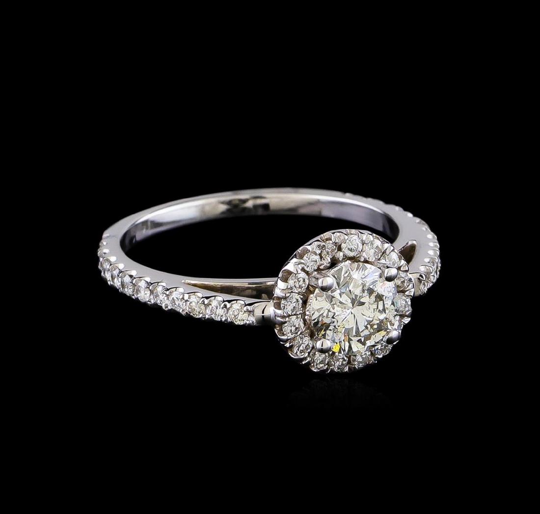 1.10 ctw Diamond Ring - 14KT White Gold: One electronically tested 14KT white gold lady's cast wedding ring with a cathedral halo with a bright polish finish. The featured lady's ring has a shank measuring 1.56 millimeters in width. Identifi