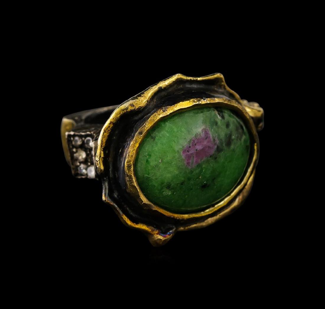 Sterling Silver Ring: One of a kind high fashion sterling silver Ring weighing 22 grams. Black Antique texture. Containing: Created Green Agate, Green Crystal, White Crystal. This sterling silver promises a lasting shine.
