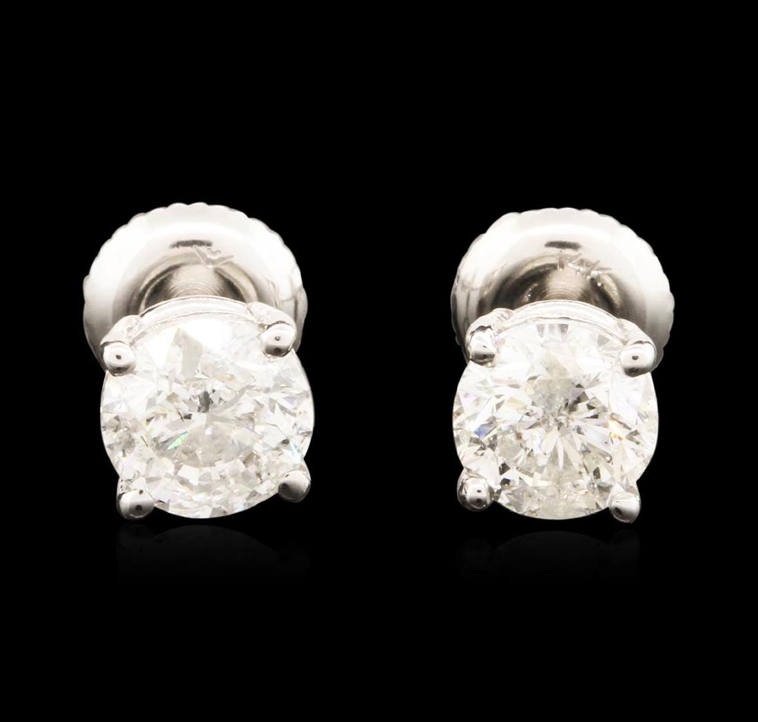 14KT White Gold 1.47 ctw Diamond Stud Earrings: One electronically tested 14KT white gold ladies cast diamond stud earrings with French screw backs with a bright polish finish. Condition is new. Containing: One prong set round brilliant cut diamond