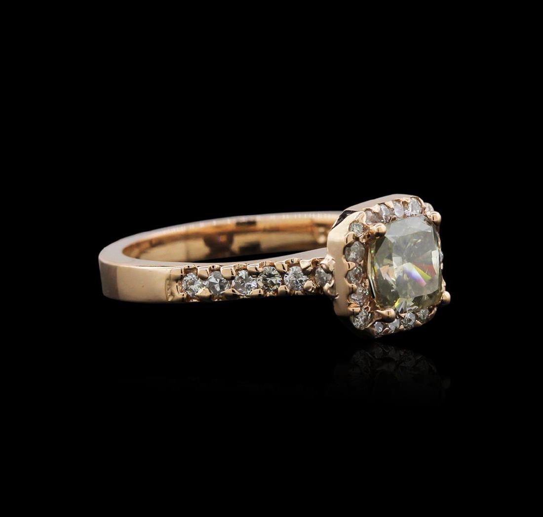 14KT Rose Gold 1.42 ctw Fancy Green Diamond Ring: One electronically tested 14KT rose gold ladies cast diamond ring with a bright polish finish. Identified with markings of "14K". Condition is new. Containing: One prong set cushion cut diamond, measu