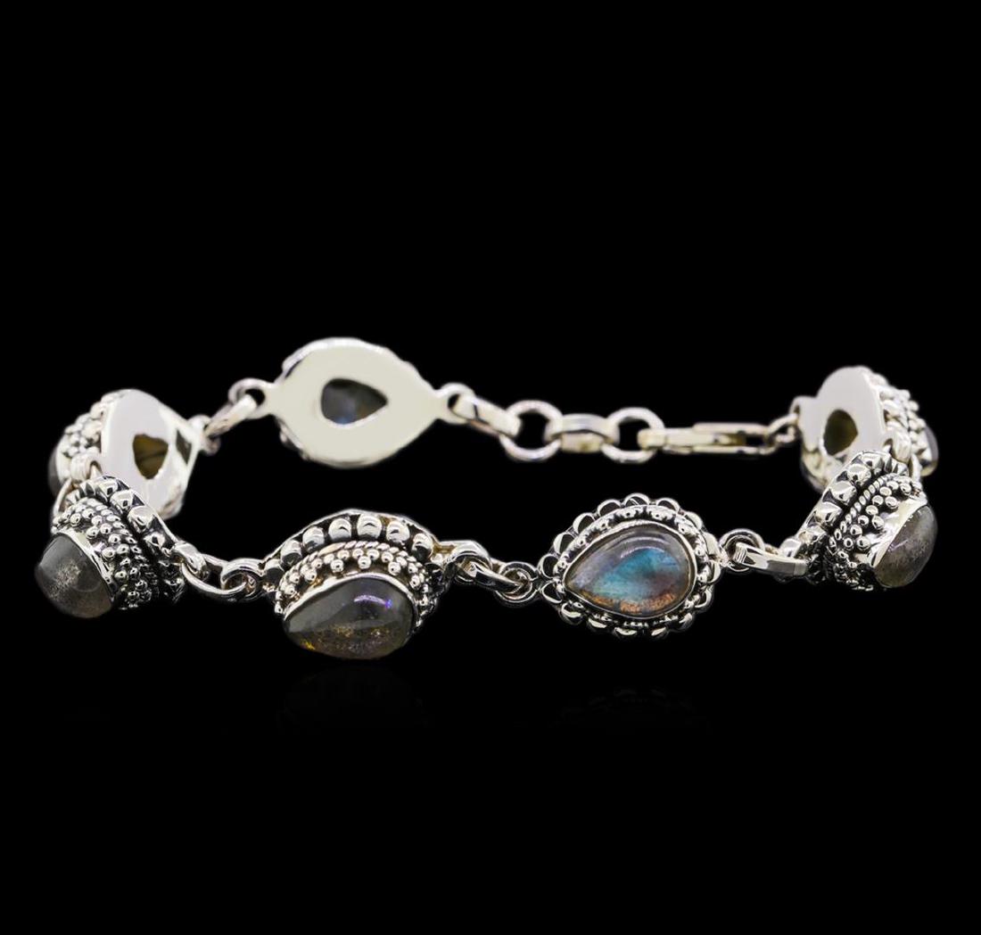 Sterling Silver Bracelet: One of a kind high fashion sterling silver Bracelet weighing 29.4 grams. Containing: Labradorite. This sterling silver promises a lasting shine.