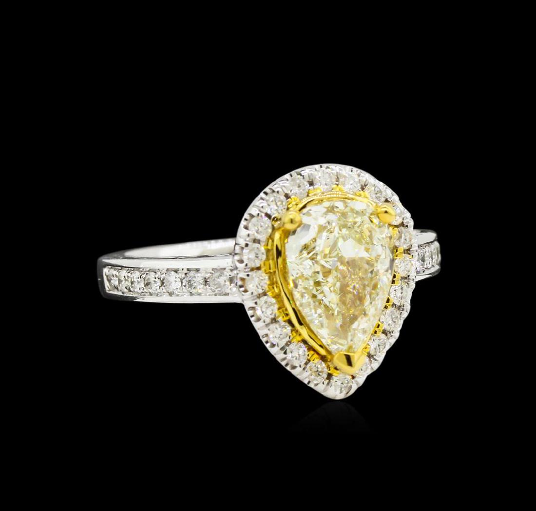 2.19 ctw Fancy Light Yellow Diamond Ring - 14KT: One electronically tested 14KT white and yellow gold lady's combination cast & assembled wedding ring with a cathedral shank with a halo with a bright polish finish. The featured lady's ring has a sha