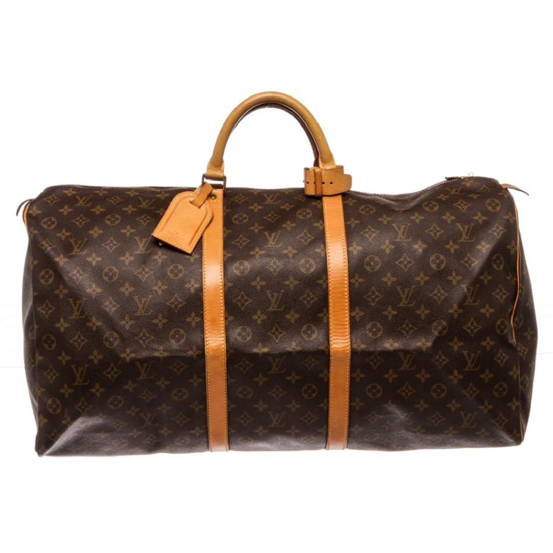 Louis Vuitton Monogram Canvas Leather Keepall 60 cm: One Louis Vuitton Monogram Canvas Leather Keepall 60 cm Duffle Bag Luggage. Brown and tan monogram coated canvas Louis Vuitton Keepall 60 with brass hardware, tan vachetta leather trim, dual rolled ha