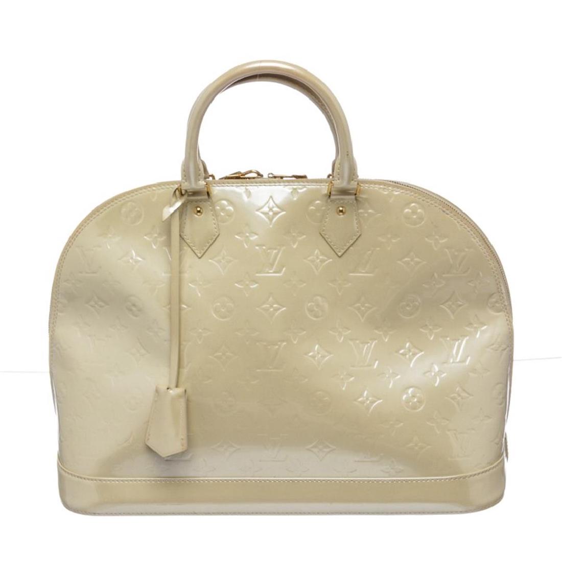 Louis Vuitton Ivory Vernis Monogram Alma GM Handbag: Ivory Louis Vuitton Vernis patent leather handle bag with brass hardware, rolled handles, key and lock at exterior, canvas lining, two interior wall pockets and zip closure at top.