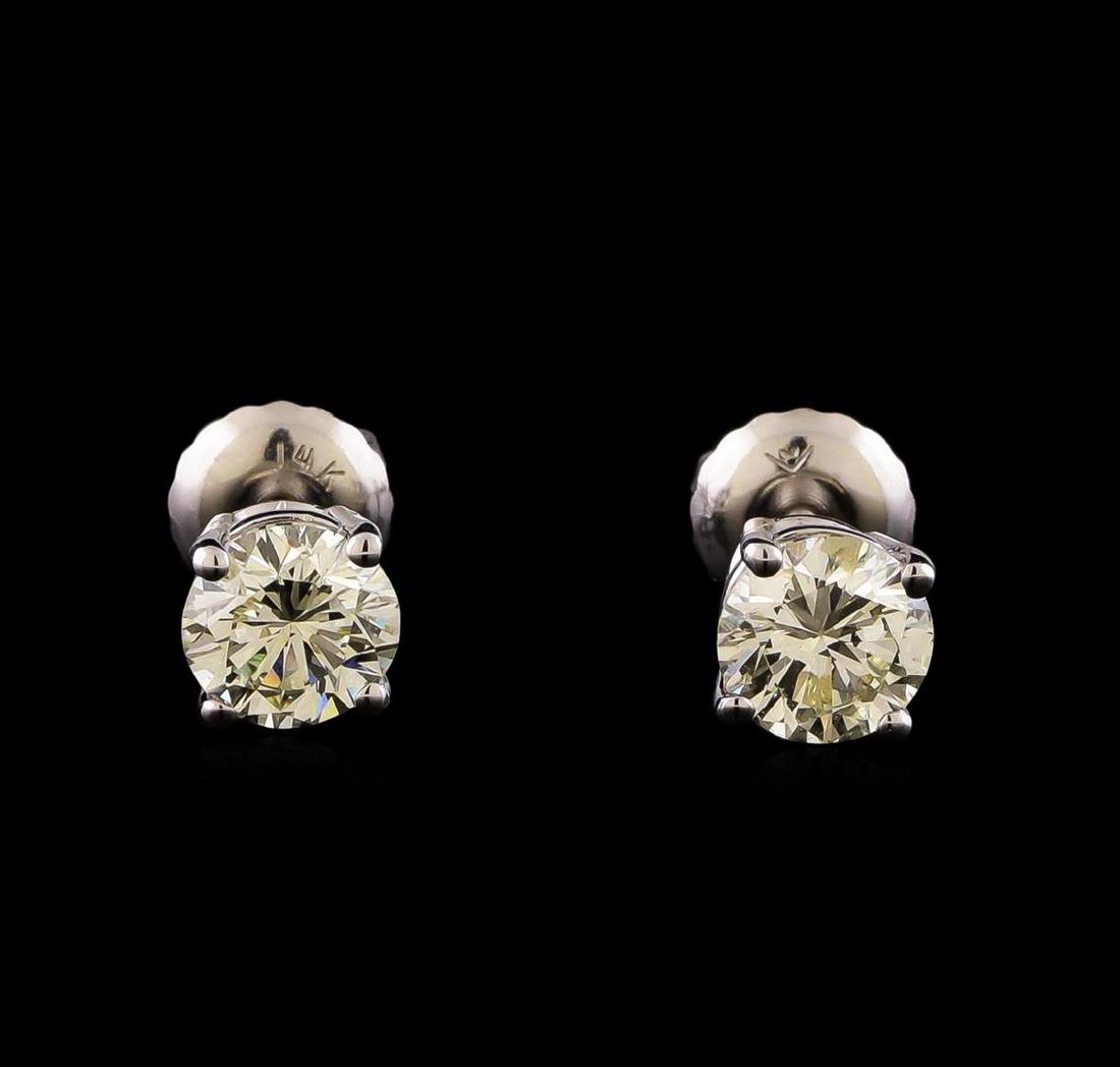14KT White Gold 1.22 ctw Diamond Solitaire Earrings: One pair electronically tested 14KT white gold cast & assembled diamond solitaire earrings with screw backs. Bright polish finish. Condition is new, good workmanship. Containing: One prong set round b