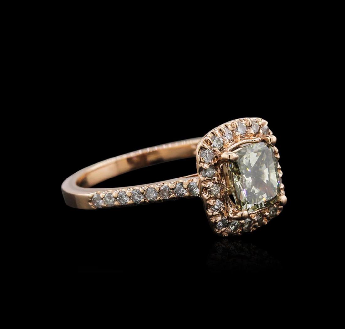 14KT Rose Gold 1.66 ctw Fancy Yellowish Green Diamond: One electronically tested 14KT rose gold ladies cast diamond ring with a bright polish finish. Identified with markings of "14K". Condition is new. Containing: One prong set cushion cut diamond, measu