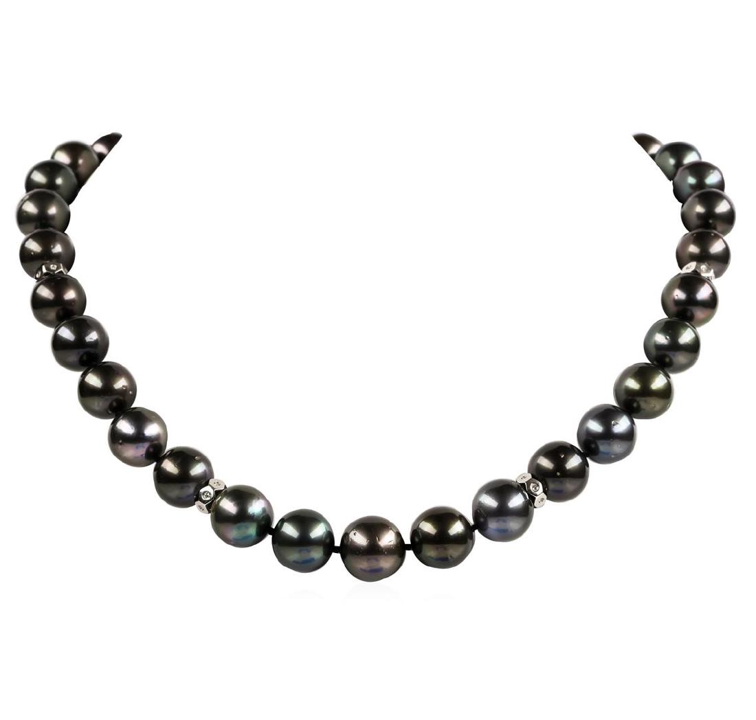Pearl and Diamond Necklace: One graduated single strand pearl necklace 19.0' princess length, knotted with a tongue clasp & foldover safety containing 33 Tahitian pearls, 14.7mm to 12.0mm in size. The pearls are black in color, 