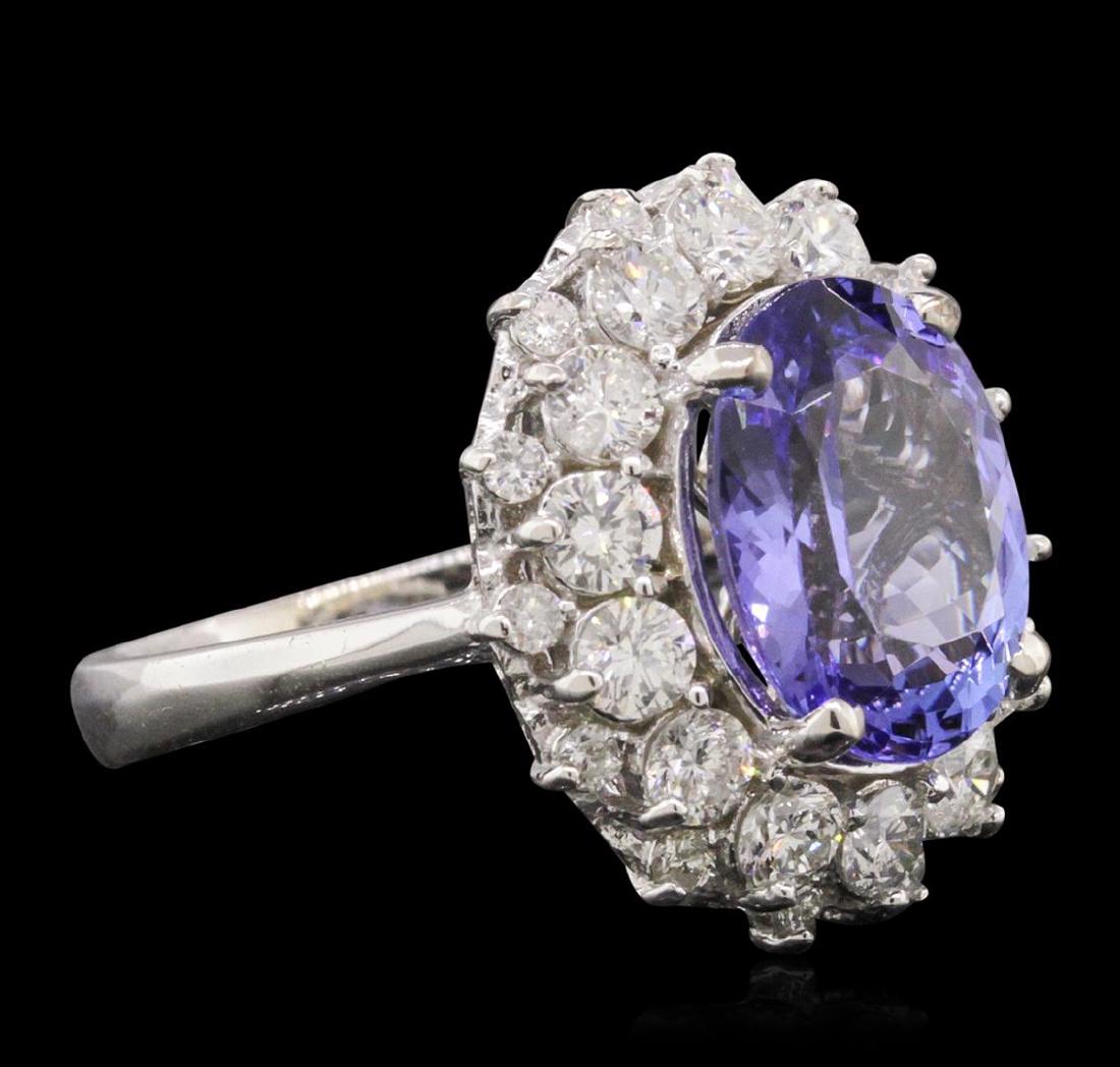 14KT White Gold 4.34 ctw Tanzanite and Diamond Ring: One electronically tested 14KT white gold ladies combination cast & assembled ring with a bright polish finish. Condition is new. Identified with markings of "K14". Containing: One prong set oval modi