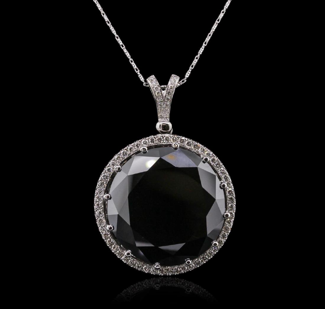 14KT White Gold 114.88 ctw Black and White Diamond: One electronically tested 14KT white gold ladies cast & assembled black and white diamond pendant with chain. Condition is new, good workmanship. The pendant features a black diamond set within a whit