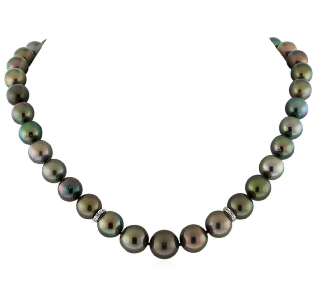 Tahitian Cultured Pearl Necklace With Diamond Clasp: One graduated single strand pearl necklace 18.0" princess length, knotted with a tongue clasp containing 37 Tahitian pearls, 10.0mm in size to 13.1mm in size. The pearls are black in color, green over